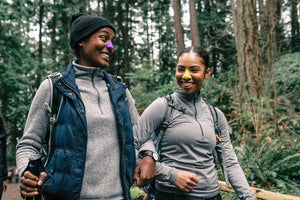 two women hiking in the forrest wearing Nöz sunscreen 